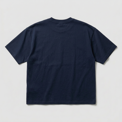 Back view of the dark navy blue oversized T-shirt on a gray #E6E6E6 background